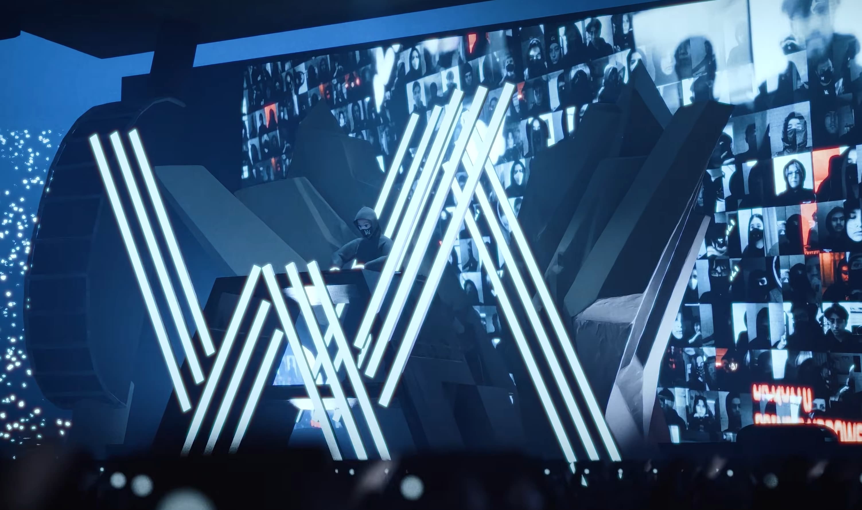 Alan Walker neon AW logo with crowd